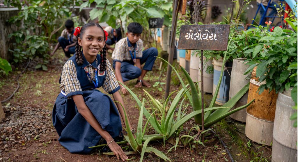 School children tend a kitchen garden at Rangpur Primary School, India