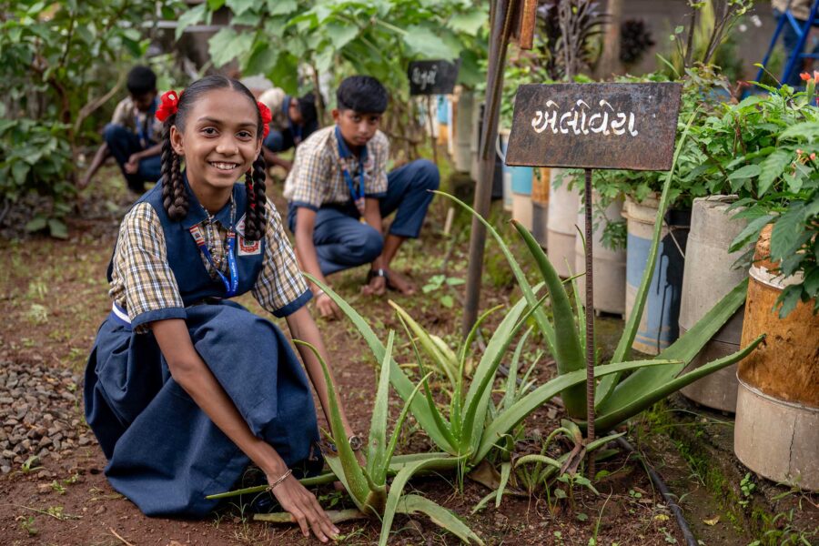 School children tend a kitchen garden at Rangpur Primary School, India
